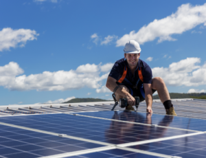 man roofer doing solar roof installation