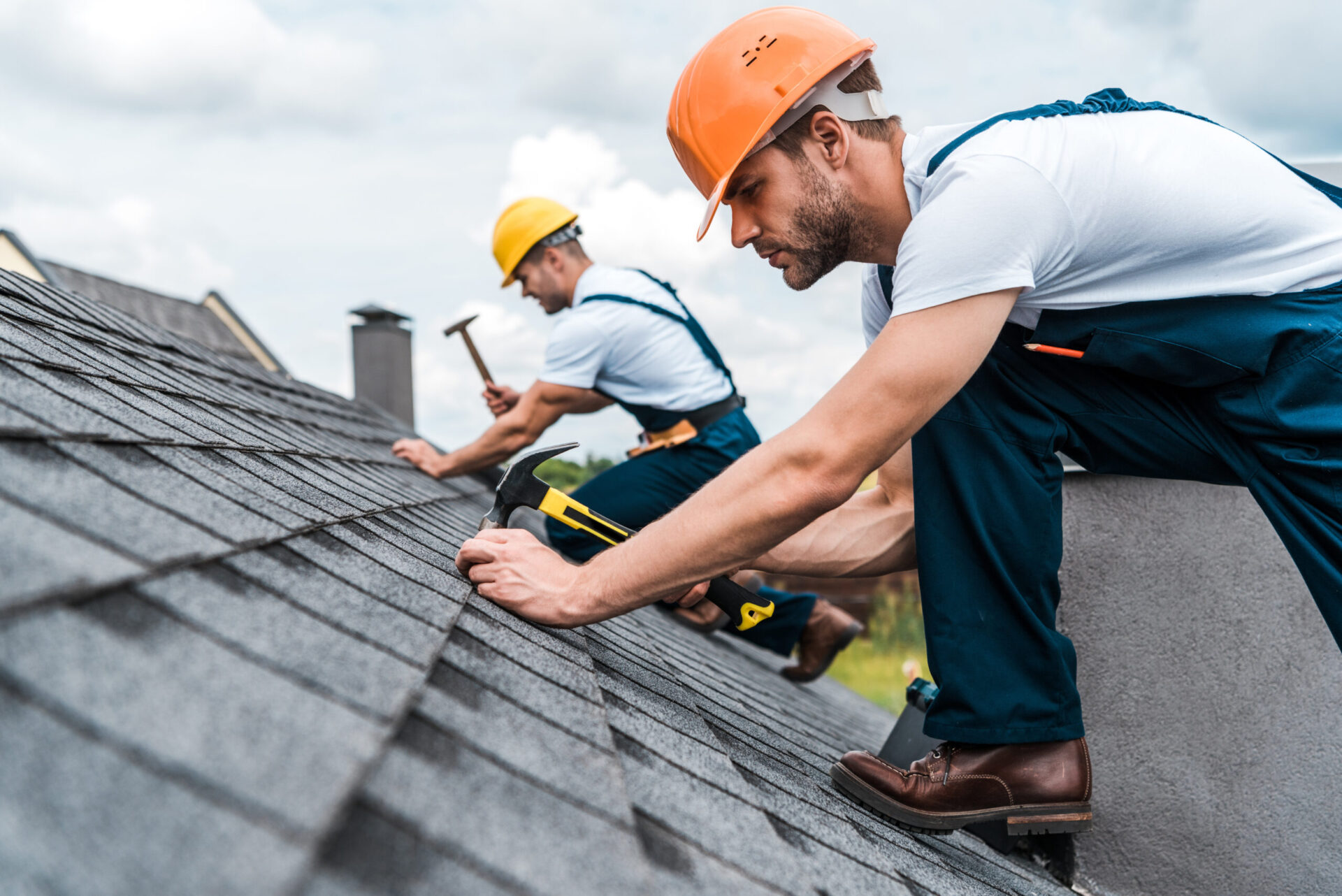 Roofer repairing roof in Vancouver