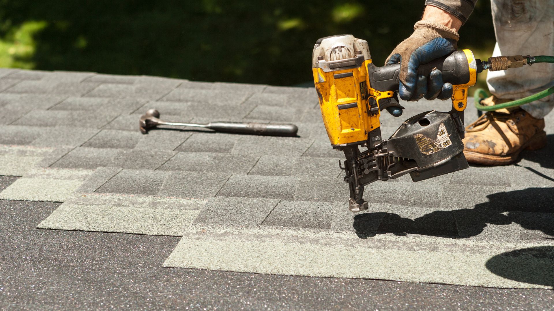 a person on a roof fixing it