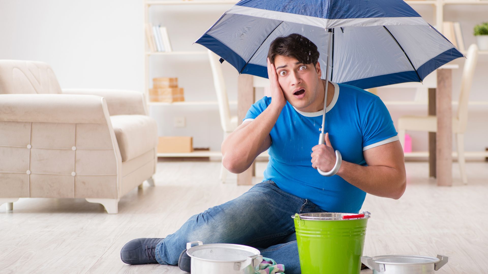 a person surprised with leaky roof and items to capture rain water