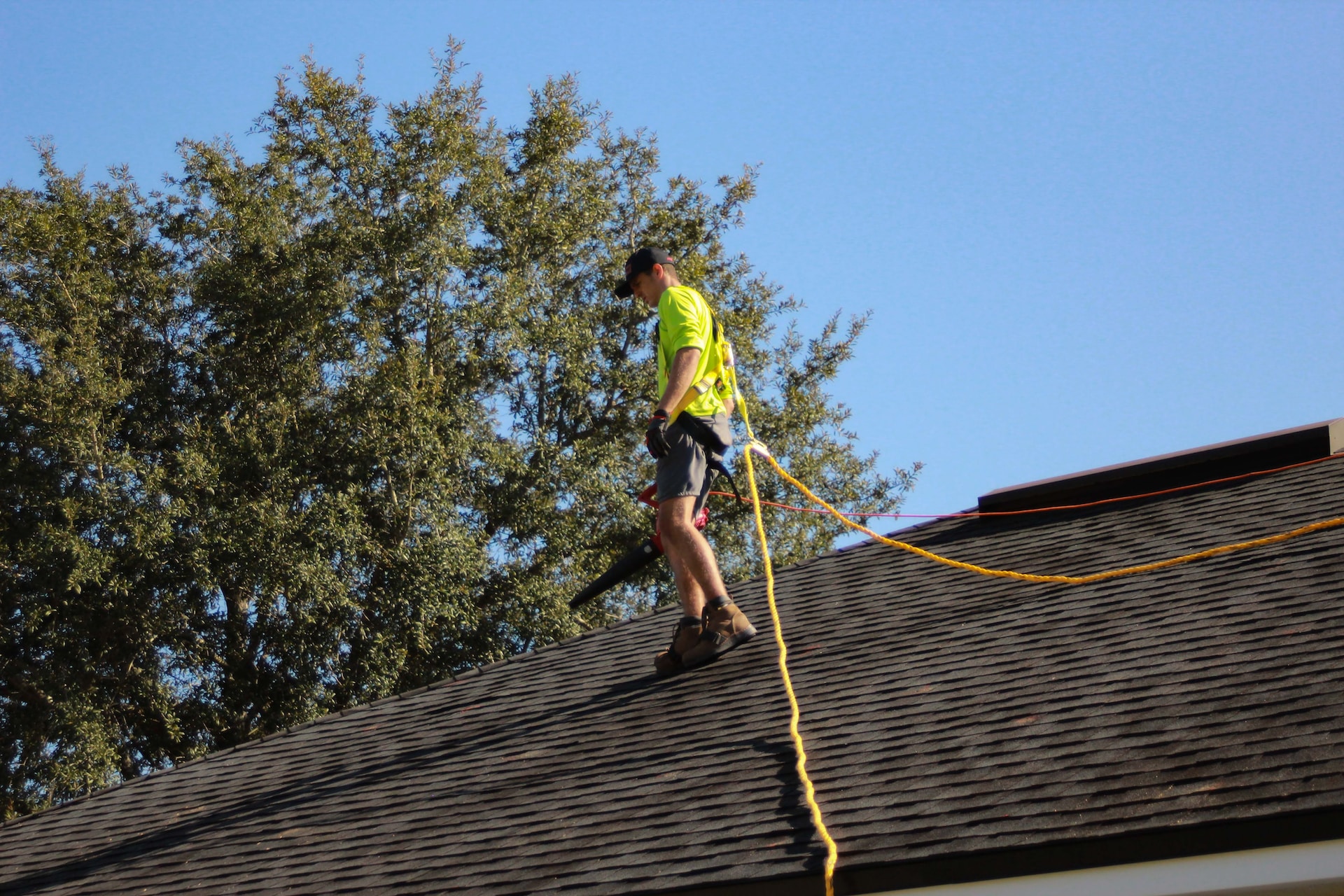 a man inspecting a roof