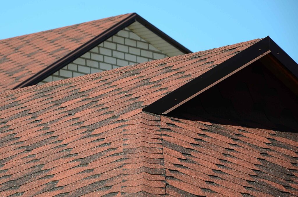 the-roof-is-covered-with-bituminous-shingles-of-brown