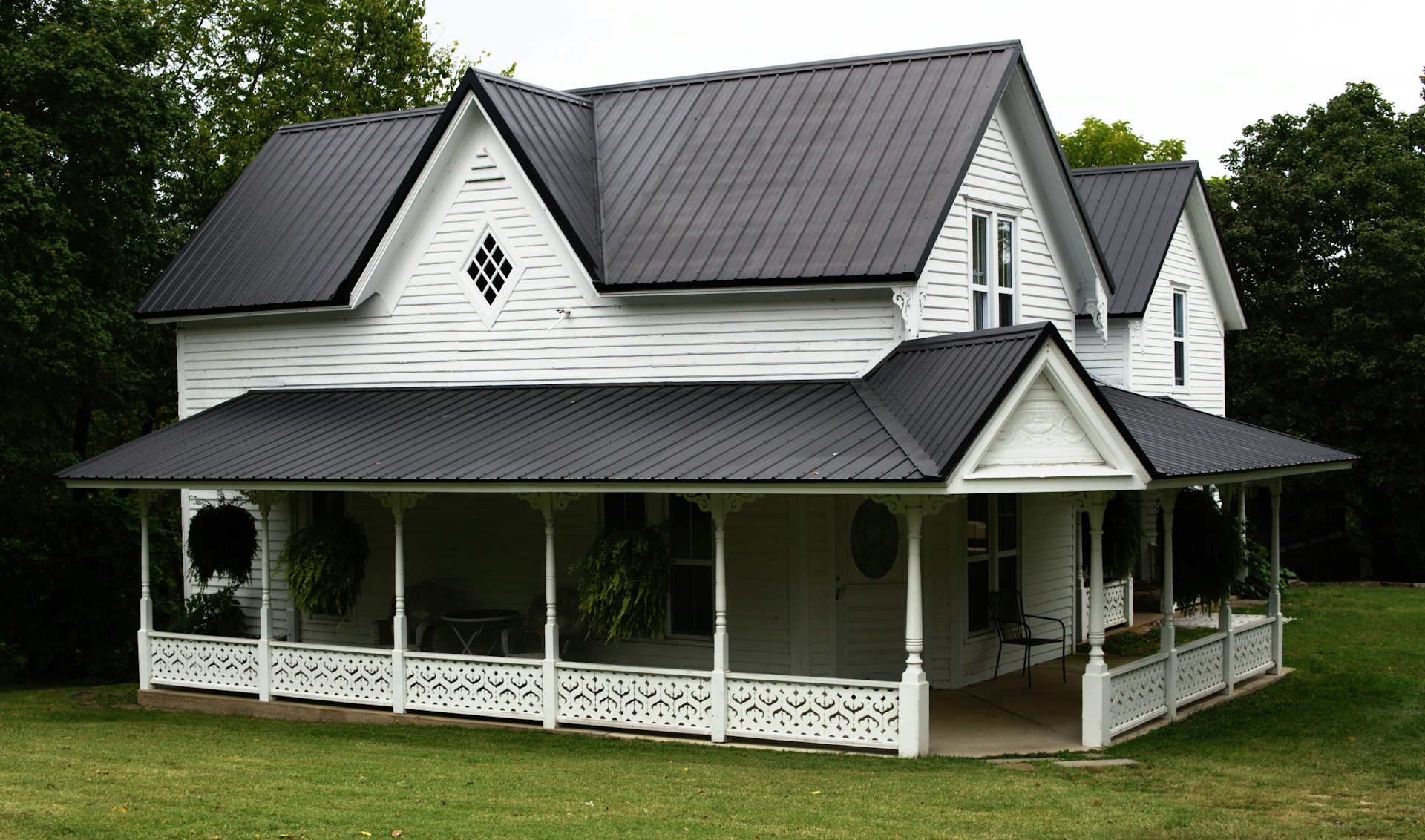 Large white house with black roof