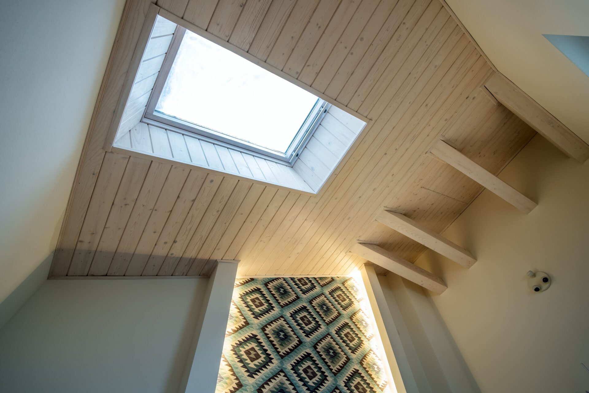 Wooden styled ceiling with skylight