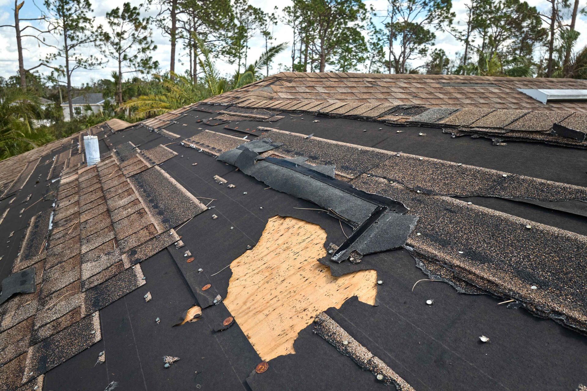 damaged house roof missing shingles