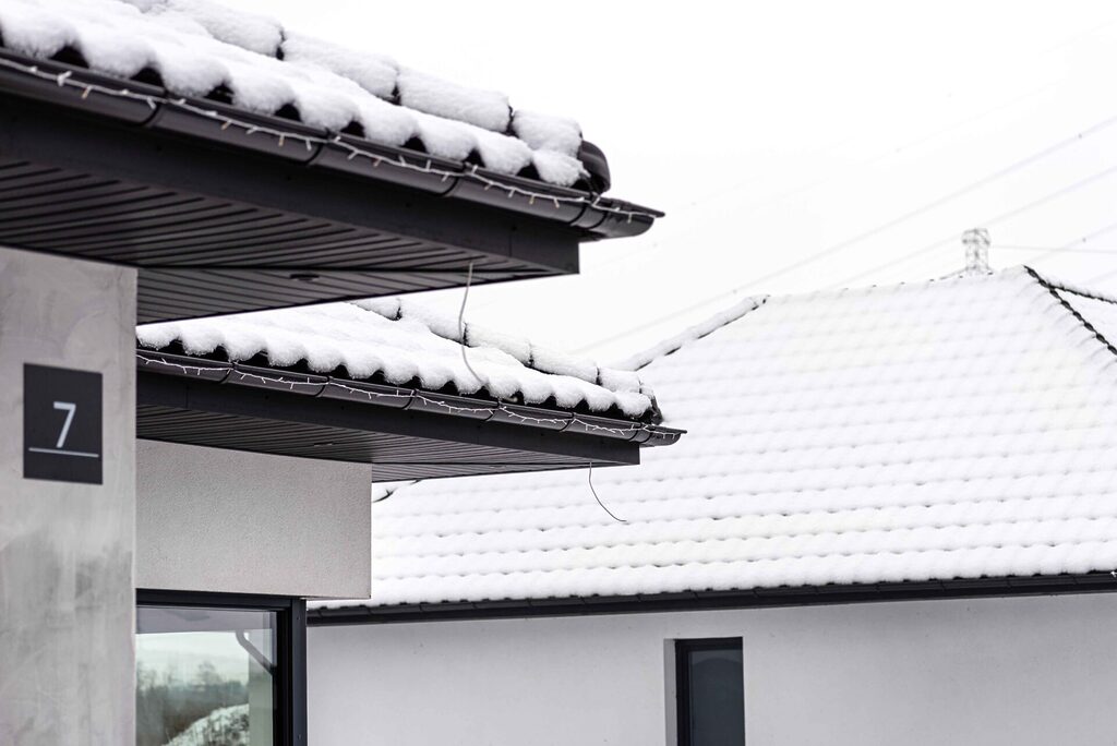 snow ice on top of roofs