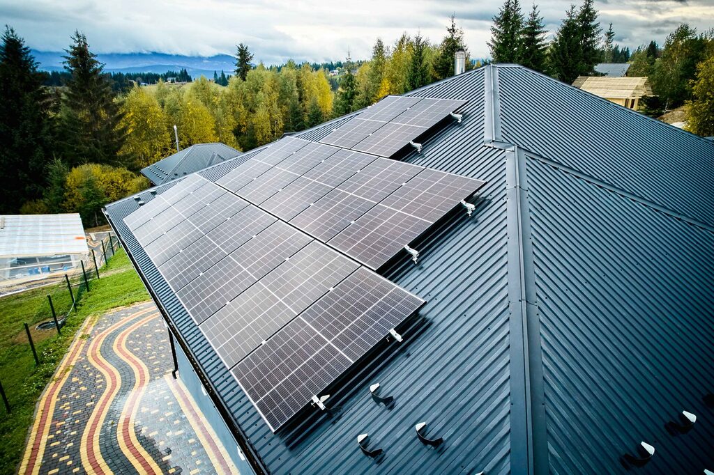 Aerial view of new modern house with solar panels