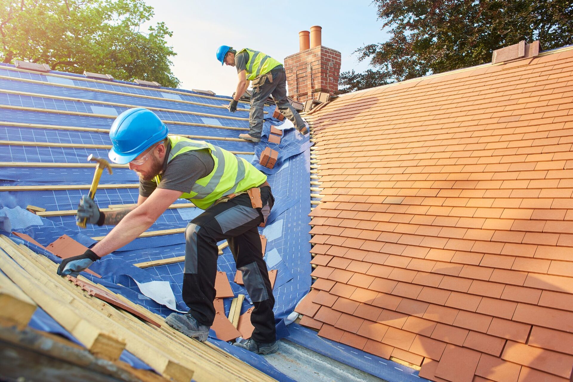 men at work fixing a roof