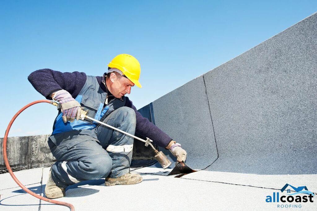 a roofing specialist working on a flat roof